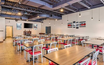Bright breakfast dining area with comfortable seating and contemporary design at Comfort Inn Laval.