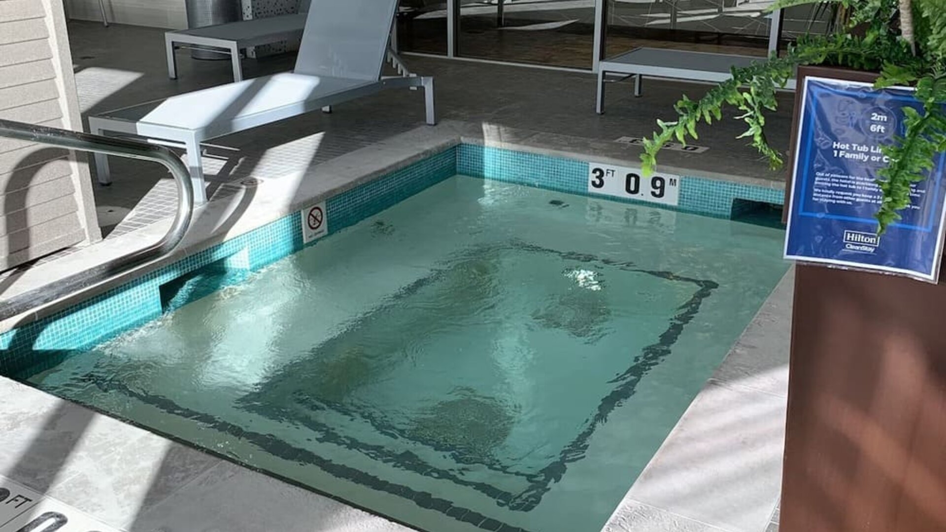 Indoor hot tub with lounge seating for relaxation at Hilton Garden Inn Calgary Downtown.