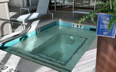 Indoor hot tub with lounge seating for relaxation at Hilton Garden Inn Calgary Downtown.