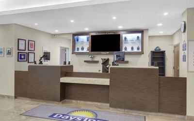Front desk reception area with friendly check-in space at Days Inn & Suites By Wyndham Lindsay.