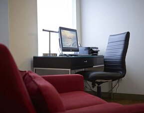Business center equipped with computer, printer, and workspace for guest convenience at Comfort Inn Amherst.