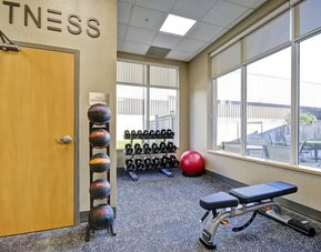 Modern fitness center featuring cardio equipment, free weights, and strength training machines at Fairfield Inn & Suites Guelph.