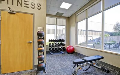 Modern fitness center featuring cardio equipment, free weights, and strength training machines at Fairfield Inn & Suites Guelph.