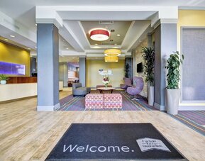 Modern hotel lobby featuring stylish seating, contemporary décor, and a welcoming reception area at Fairfield Inn & Suites Guelph.