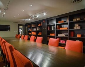 Executive boardroom with professional seating and a sophisticated setting for business meetings at ARC The Hotel Ottawa.