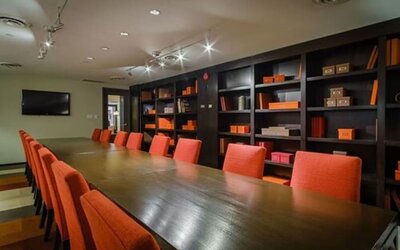 Executive boardroom with professional seating and a sophisticated setting for business meetings at ARC The Hotel Ottawa.