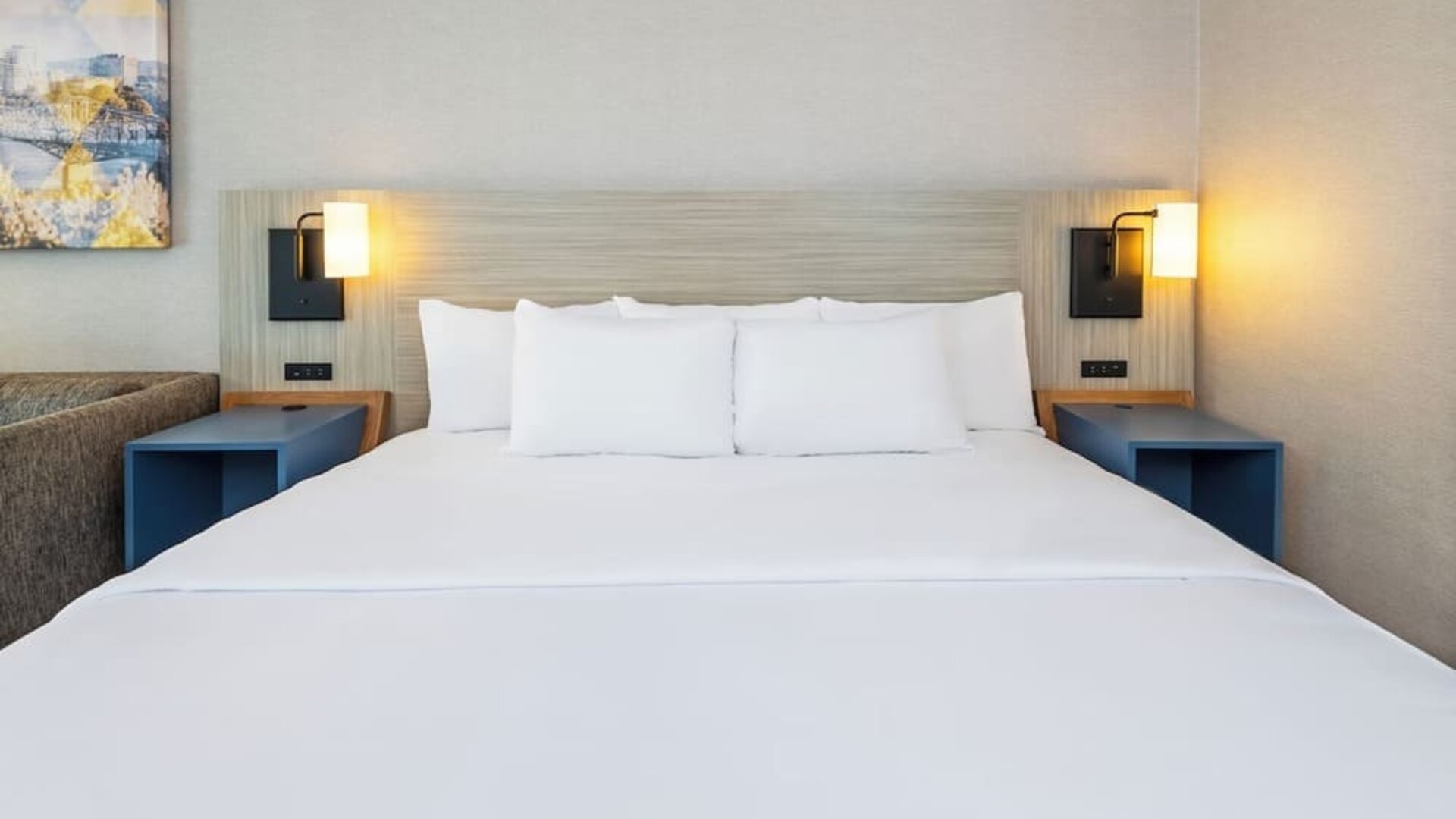Close-up view of the plush king bed with premium linens for a restful night's sleep at Comfort Inn Airport East Ancienne-Lorette.