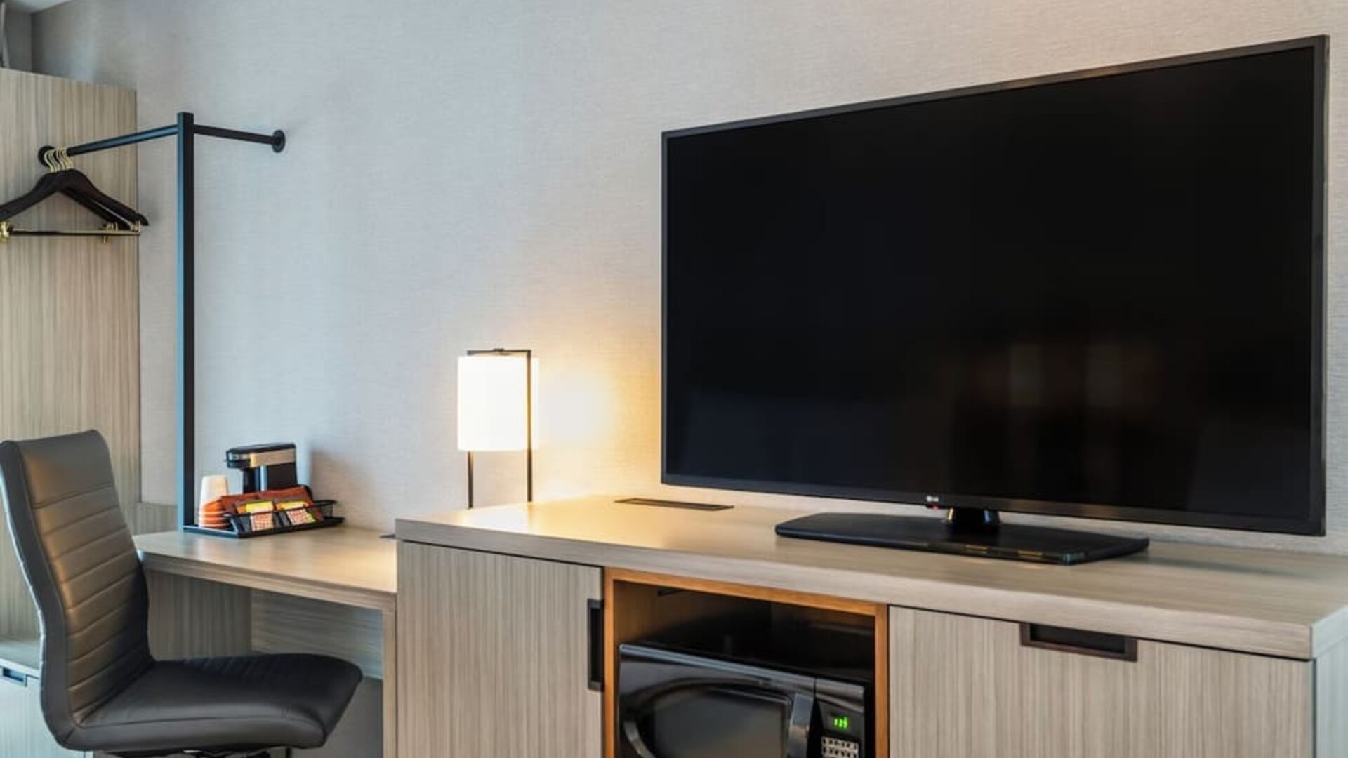 Dedicated in-room workspace with an ergonomic desk, coffee station, and convenient amenities for productive stays at Comfort Inn Airport East Ancienne-Lorette.