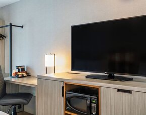 Dedicated in-room workspace with an ergonomic desk, coffee station, and convenient amenities for productive stays at Comfort Inn Airport East Ancienne-Lorette.