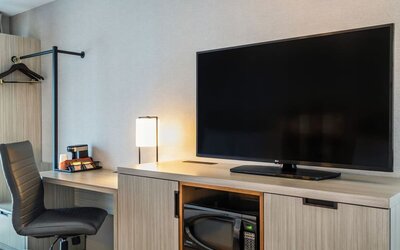 Dedicated in-room workspace with an ergonomic desk, coffee station, and convenient amenities for productive stays at Comfort Inn Airport East Ancienne-Lorette.