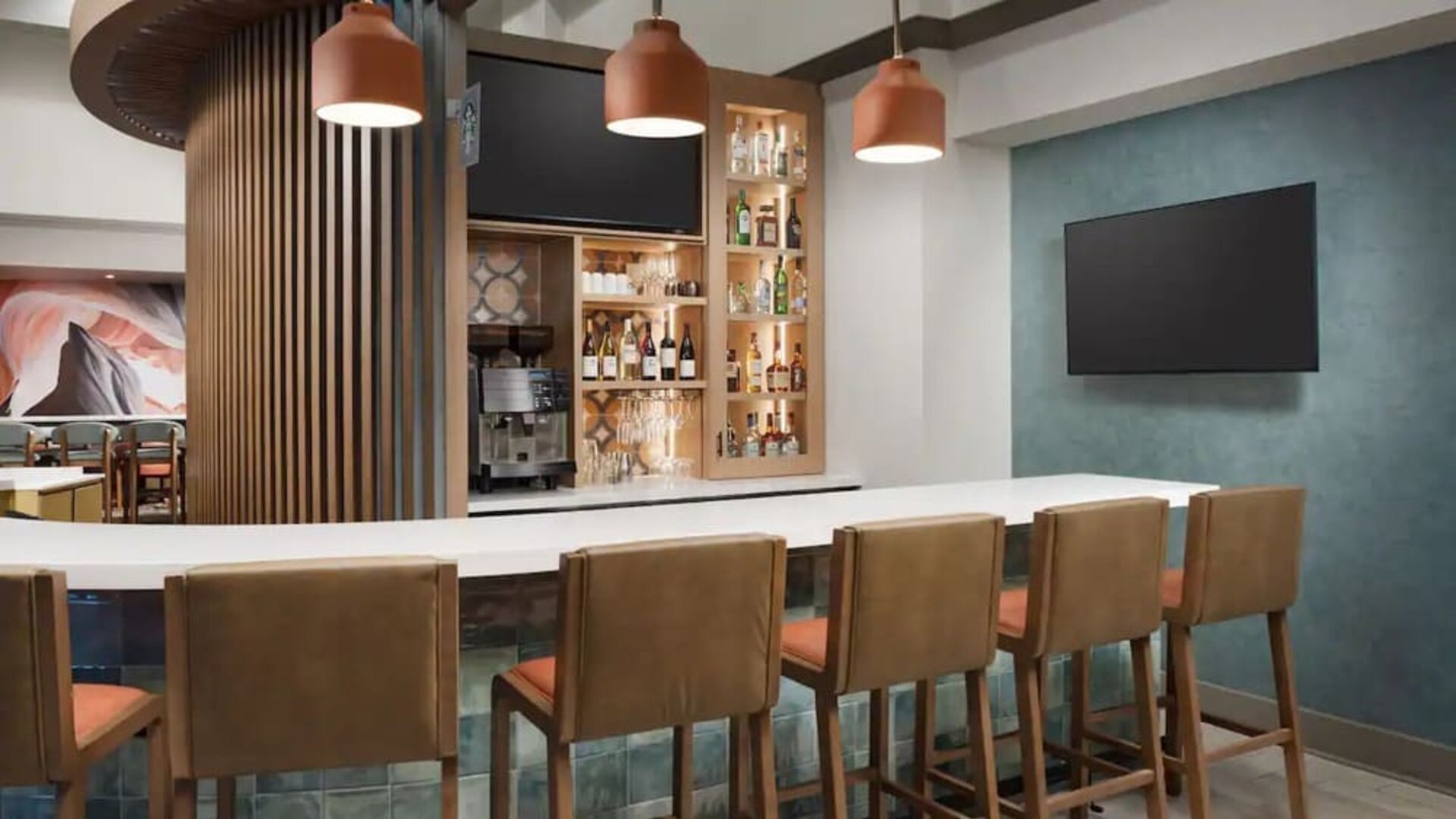 Modern hotel bar featuring handcrafted cocktails, premium spirits, comfortable seating, and a welcoming atmosphere at Hyatt Place Scottsdale/Old Town.
