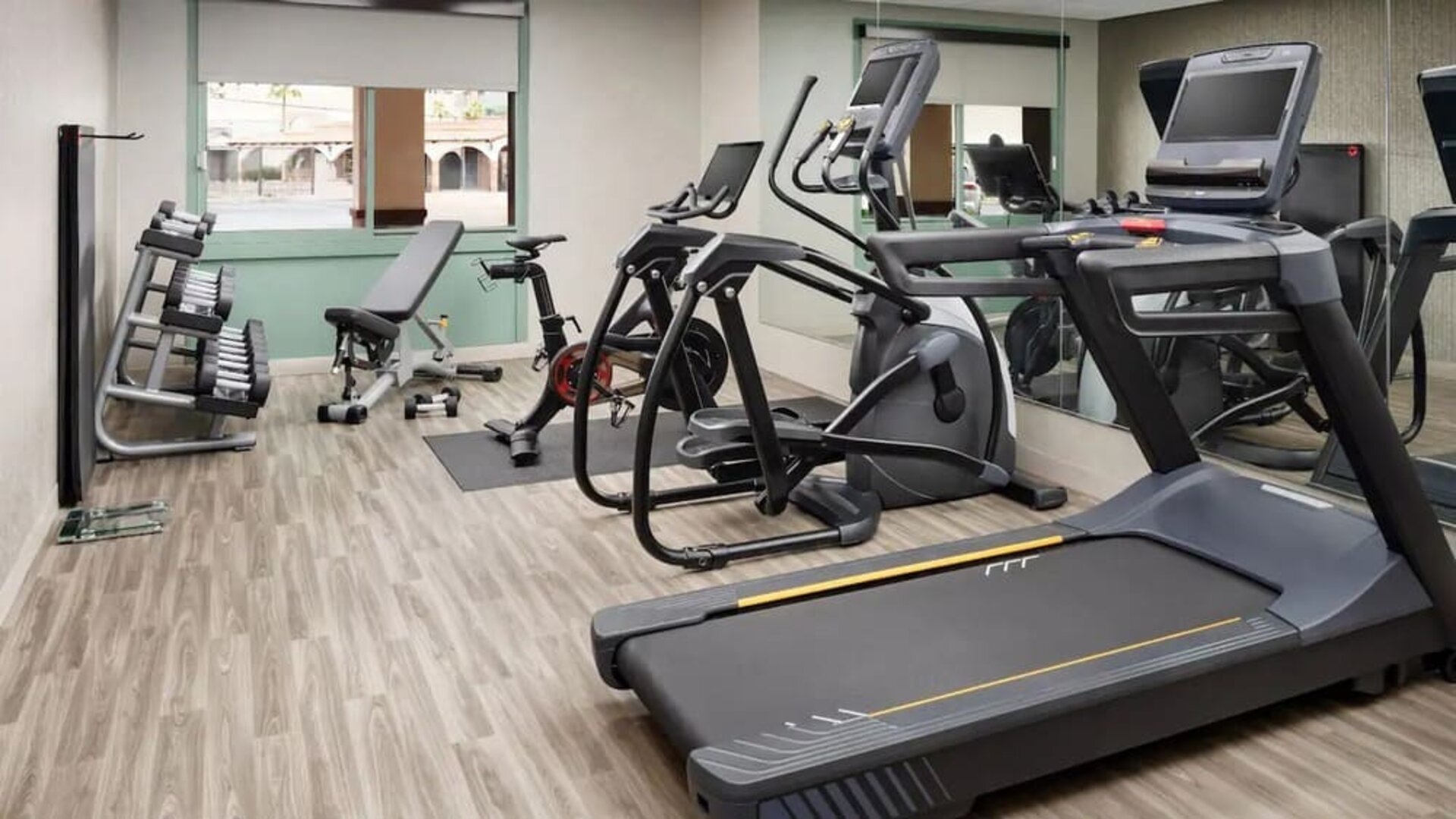 Modern fitness center equipped with cardio machines, free weights, and strength-training equipment at Hyatt Place Scottsdale/Old Town.