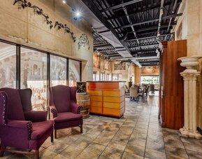 Restaurant entrance with lounge seating at Comfort Inn Brantford.