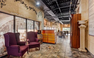 Restaurant entrance with lounge seating at Comfort Inn Brantford.