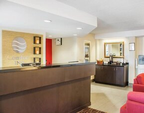 Welcoming reception desk with seating at Comfort Inn Brantford.