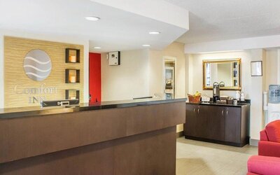 Welcoming reception desk with seating at Comfort Inn Brantford.
