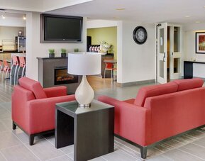 Hotel lobby with fireplace and lounge seating at Comfort Inn Brandon.