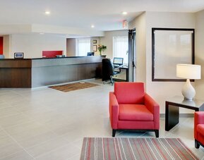 Hotel lobby with reception desk and seating area at Comfort Inn Brandon.