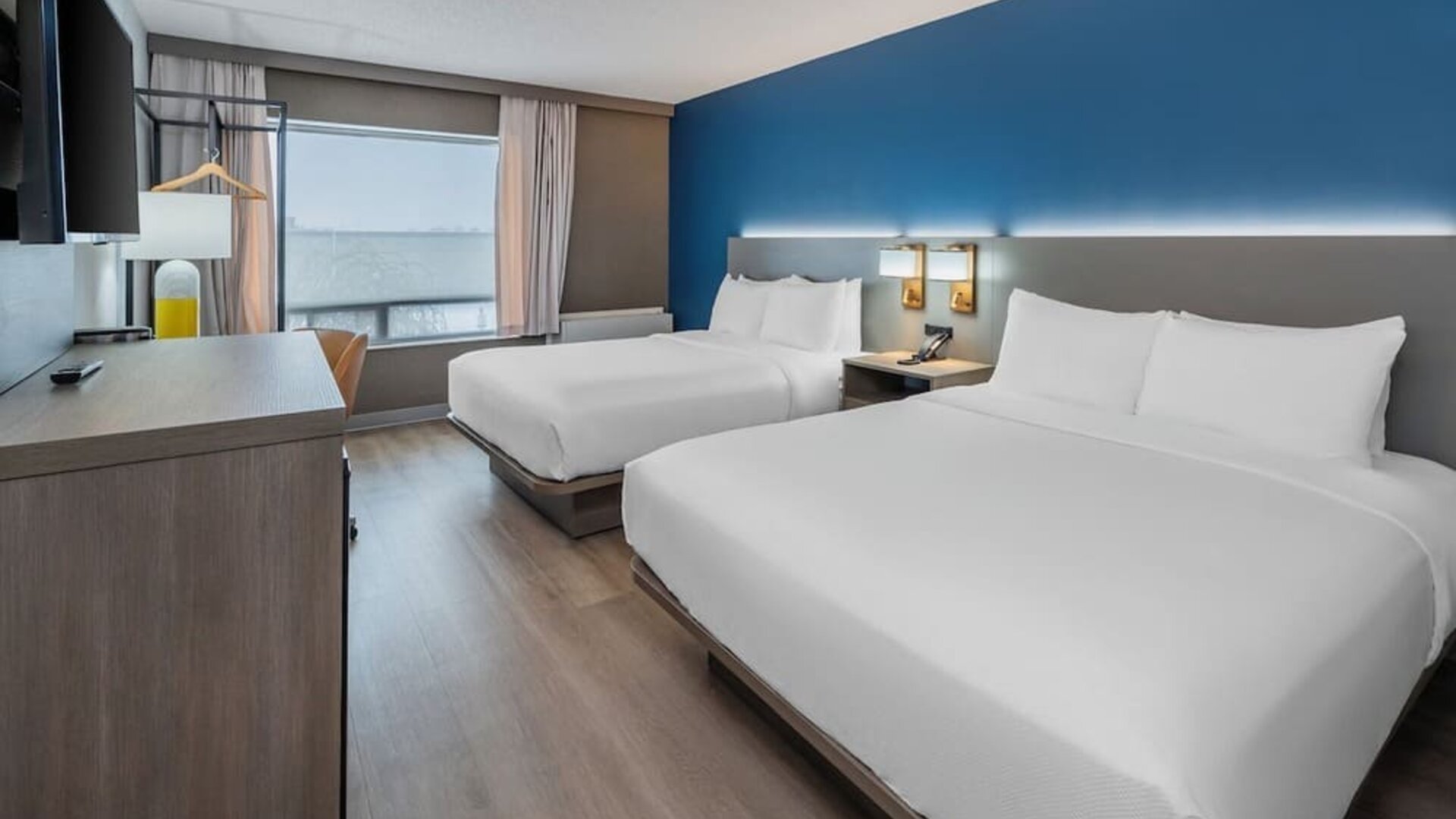 Guest room with two queen beds and modern décor at Comfort Inn Belleville.