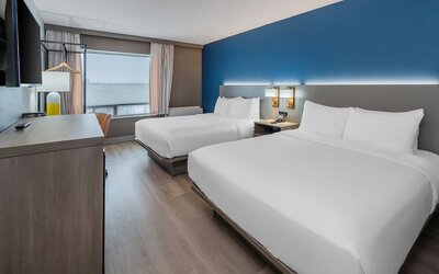 Guest room with two queen beds and modern décor at Comfort Inn Belleville.