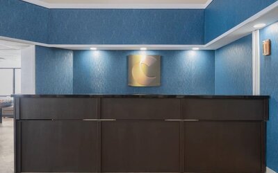 Hotel reception desk with modern design at Comfort Inn Belleville.