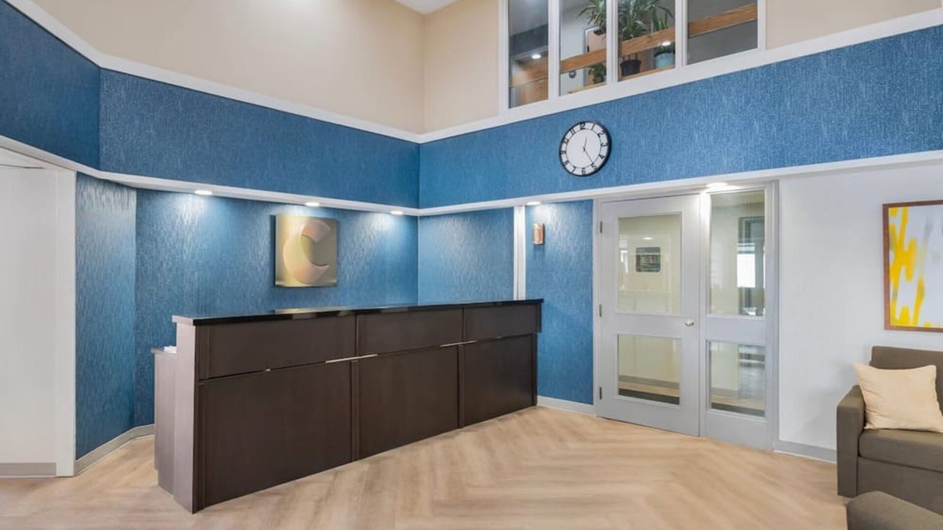 Hotel reception area with modern lobby design at Comfort Inn Belleville.