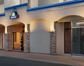 Hotel entrance with covered driveway at Days Inn Edmonton Downtown.