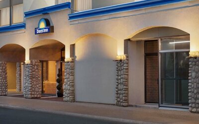 Hotel entrance with covered driveway at Days Inn Edmonton Downtown.