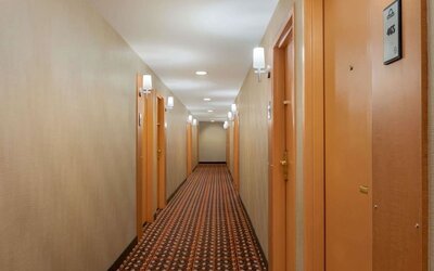 Guest hallway with room entrances at Days Inn Edmonton Downtown.