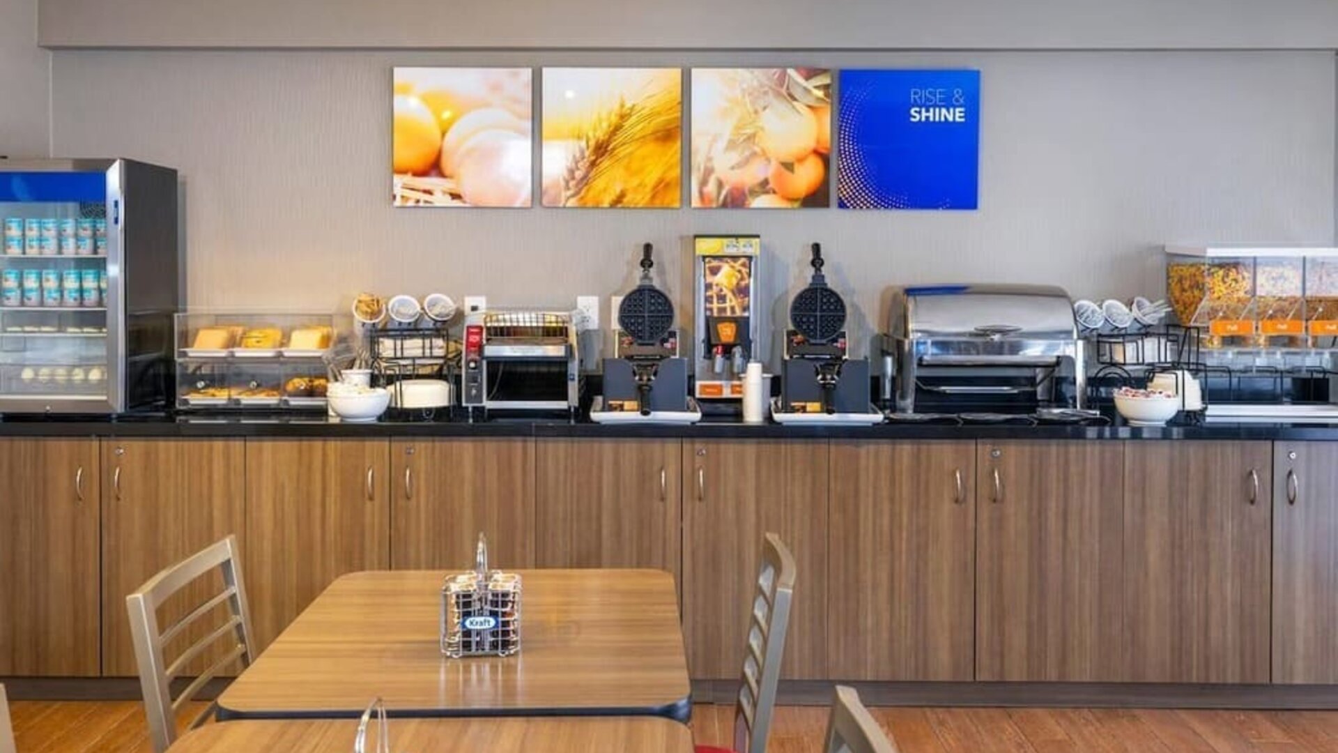 Complimentary breakfast station with waffles, cereals, and hot beverages at Comfort Inn Val D'Or.