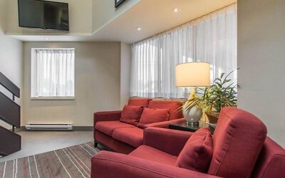 Hotel lobby with business center and reception area at Comfort Inn Val D'Or.