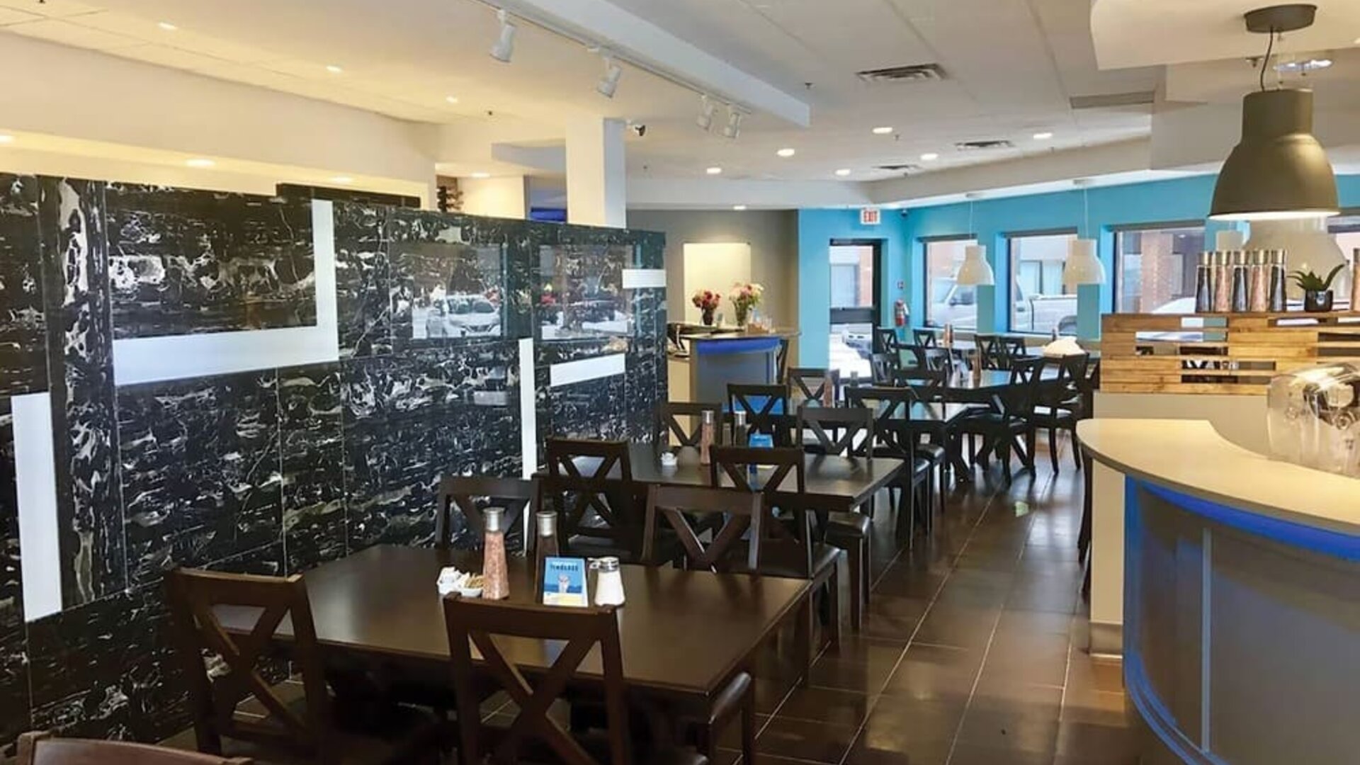 Hotel dining area with tables and breakfast buffet at Comfort Inn Edmonton West.