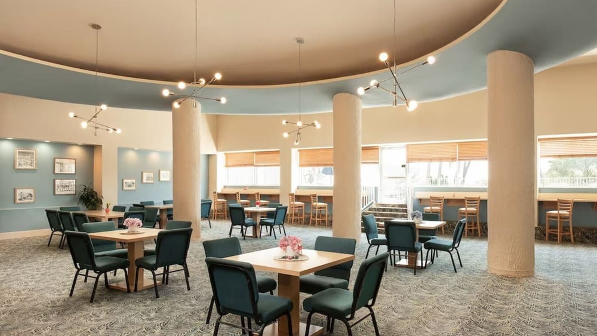 Hotel dining and lounge area with table seating at Sherry Frontenac Oceanfront Hotel.