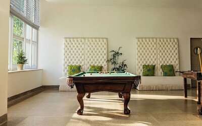 Hotel game room with a billiards table at Sherry Frontenac Oceanfront Hotel.