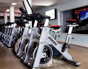 Fitness center with indoor spinning bikes at Sherry Frontenac Oceanfront Hotel.
