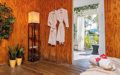 Spa relaxation area with robes and seating at Sherry Frontenac Oceanfront Hotel.