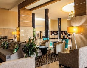 Hotel lobby lounge with comfortable seating at Sherry Frontenac Oceanfront Hotel.