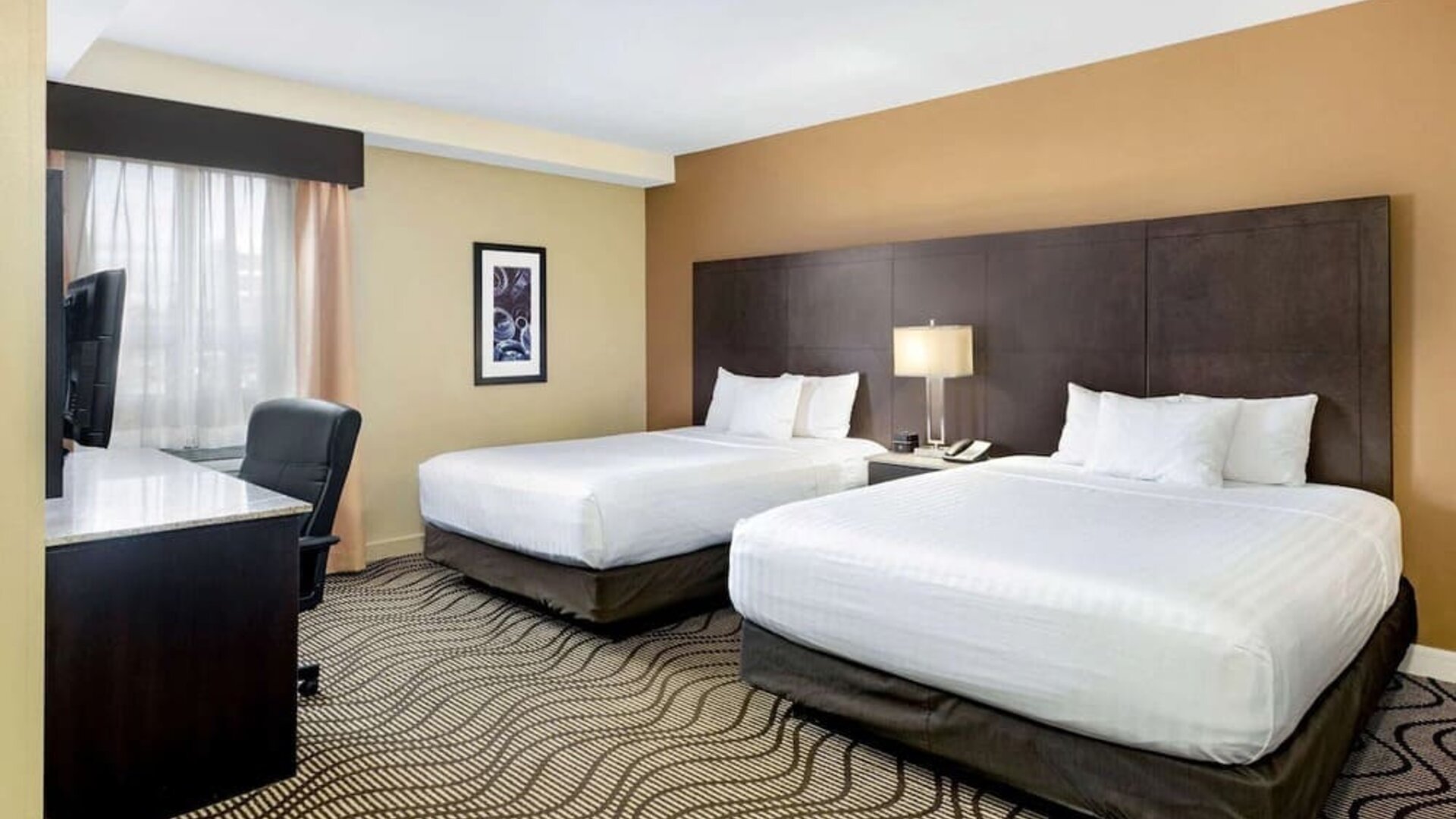 Guest room with two queen beds at La Quinta Inn & Suites By Wyndham Oshawa.