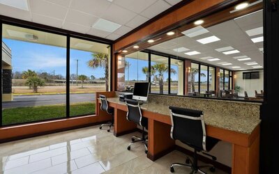 Business center with computer workstations, large windows and roadside views at Quality Inn Yemassee - Point South I-95.