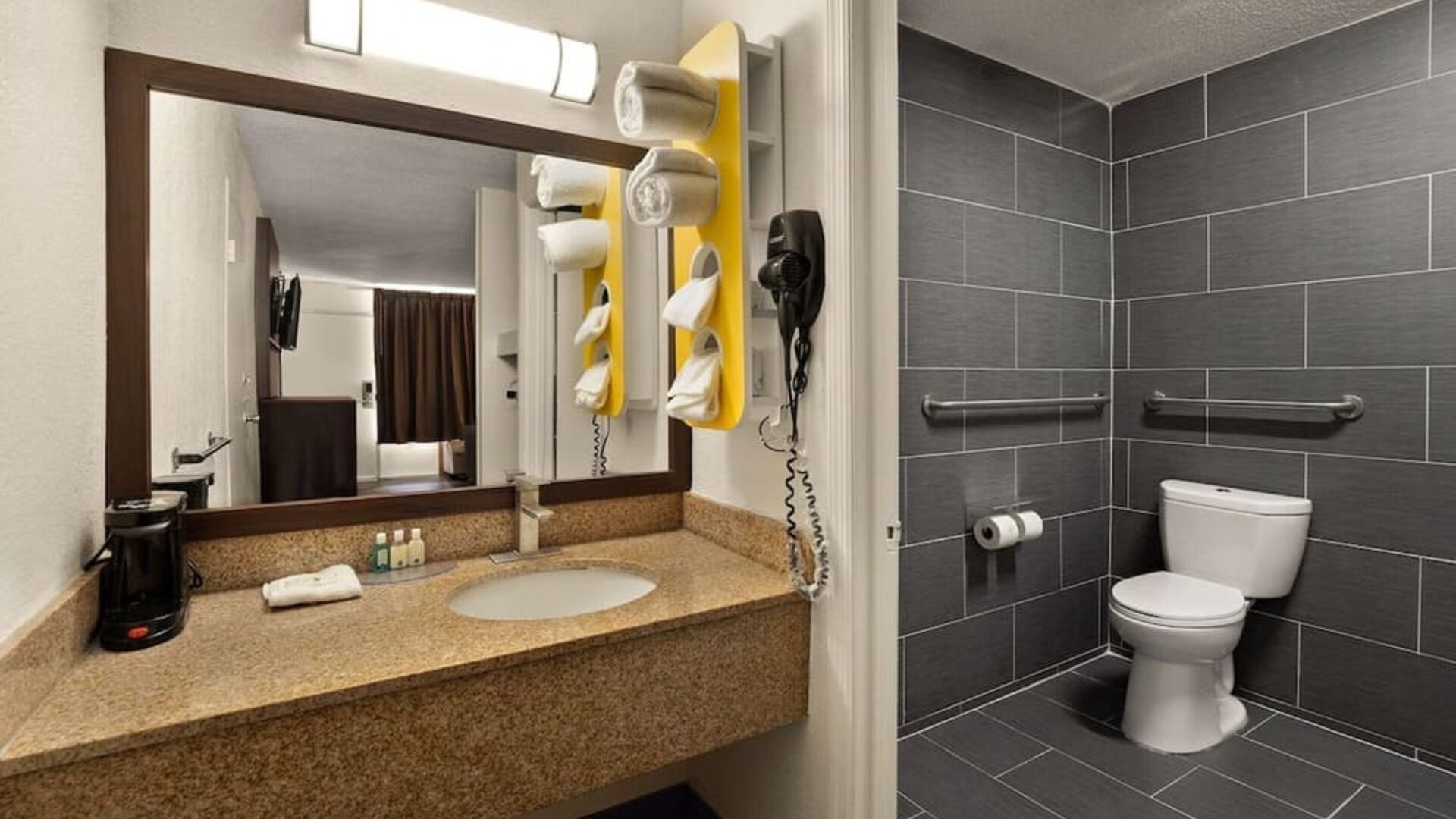 Accessible bathroom with granite vanity, grab bars and roll-in shower area at Quality Inn Yemassee - Point South I-95.