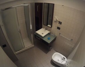 Spacious bathroom with bidet, vanity sink and complimentary toiletries at Dolce Vita Rooms & Breakfast.