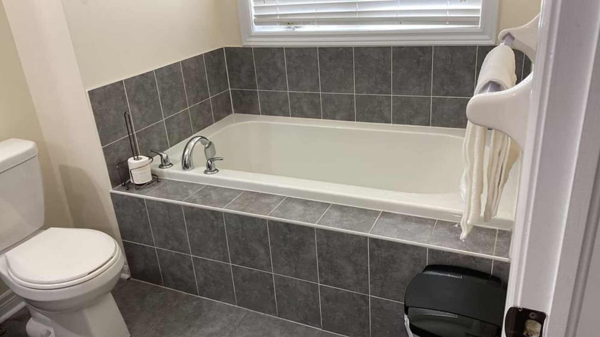 Guest bathroom with tub at Home Stay Canada.