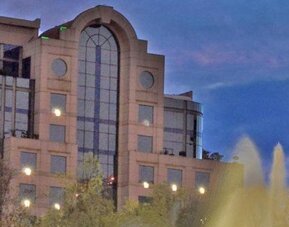 Exterior view of Hotel Marquis Reforma with the hotel building and Diana the Huntress fountain in the foreground.