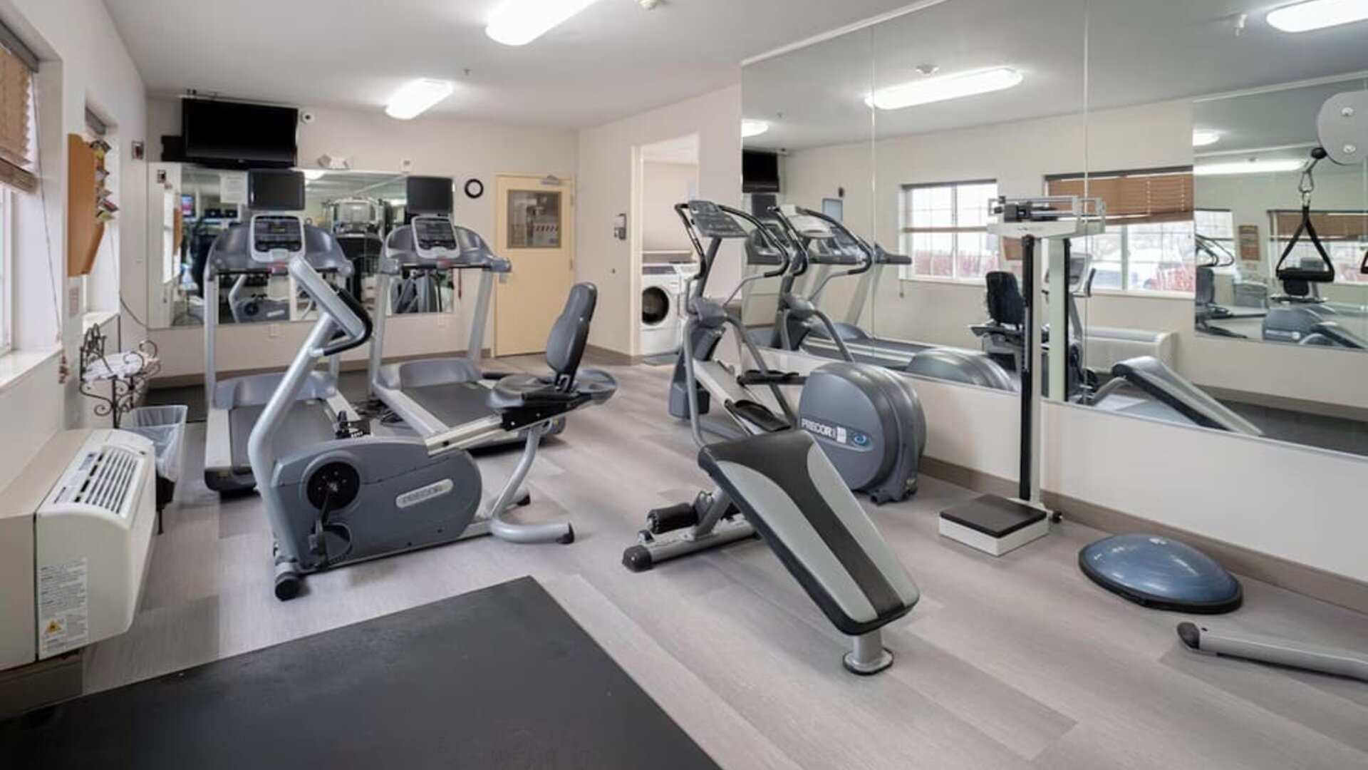 Fitness center featuring cardio equipment, strength-training machines and mirrored walls for convenient workouts at Candlewood Suites Boise.