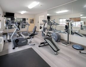 Fitness center featuring cardio equipment, strength-training machines and mirrored walls for convenient workouts at Candlewood Suites Boise.