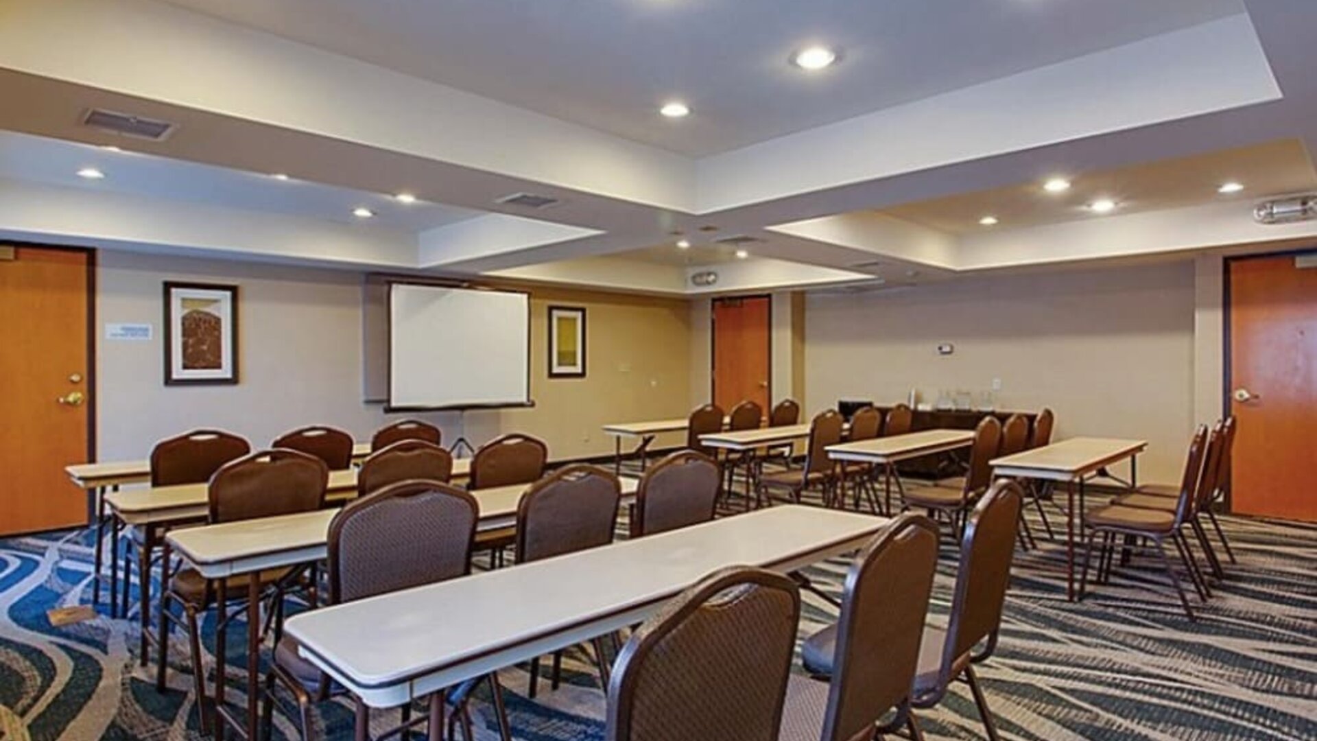 Meeting facility featuring flexible seating arrangements, presentation equipment and a spacious layout for business gatherings at Holiday Inn Express SFO Airport North.