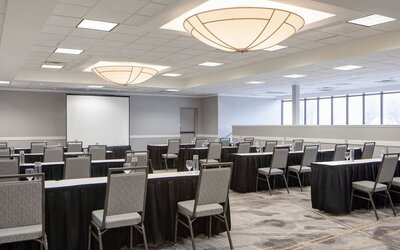Meeting room featuring classroom-style seating, presentation equipment, and flexible event space at Houston Marriott South at Hobby Airport.