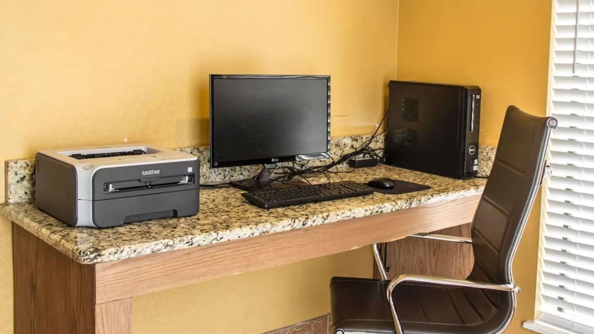 Business centre with desktop computer, printer, work desk, and office chair at Comfort Suites San Antonio SeaWorld - Lackland AFB.