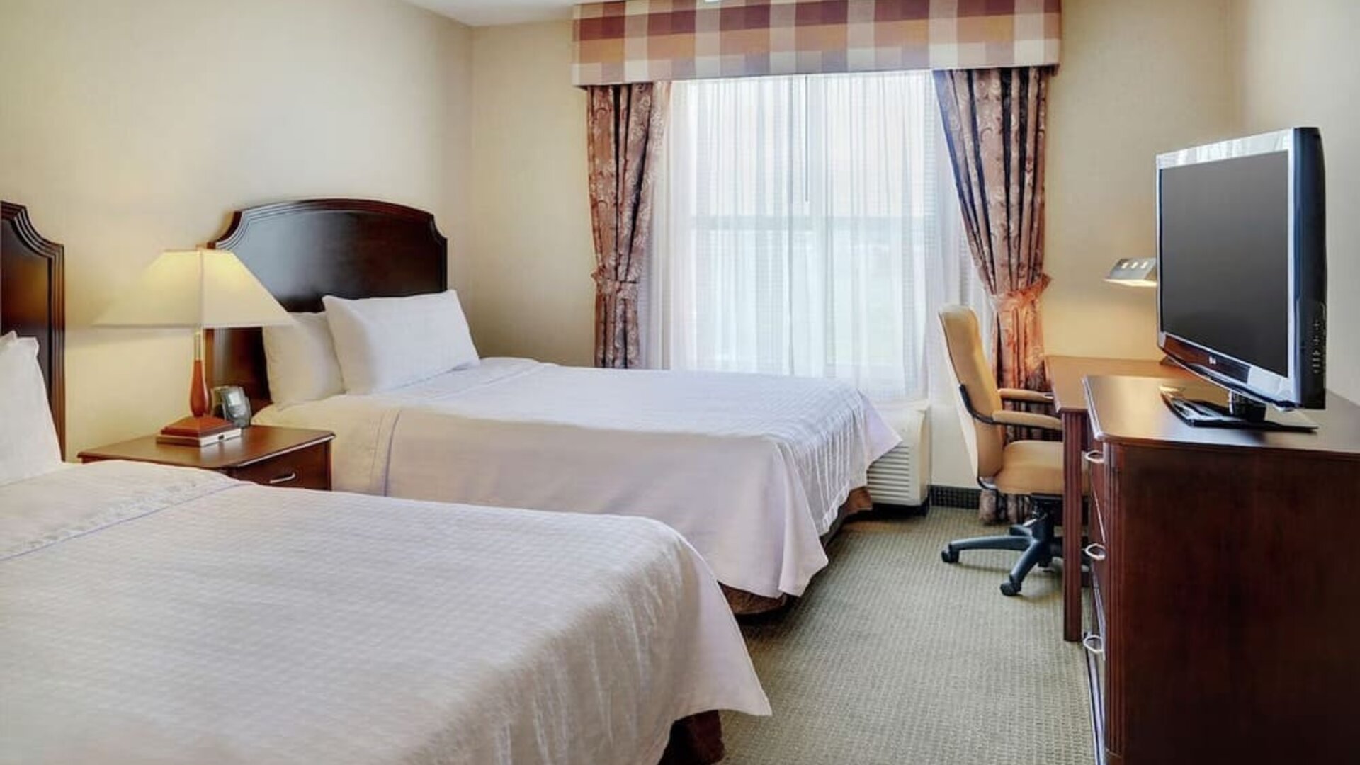 Day use twin room with TV and work desk at Homewood Suites By Hilton Burlington.