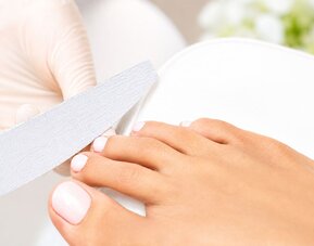 Pedicure treatment at SKYLARANNA Resort & Spa, featuring professional nail care and grooming.
